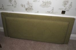 A sage green patterned upholstered headboard, 81cm H, 199cm W,