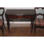 A George IV mahogany fold over tea table. Turned legs and one hinged versa, 75cm H, 92cm W, 88cm D.