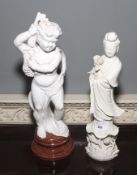 An Italian glazed ceramic figure of the young Baccus with grapes on a circular socle together with