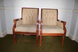 A pair of 20th century mahogany armchairs, 102cm H 69cm W 63cm, with button back upholstered seat,