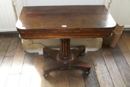 A George IV rosewood fold over card table.