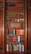 An assortment of bound books including Bibles, Short History of the English People,