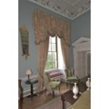 A pair of damask silk lined curtains and matching tasselled pelmet.