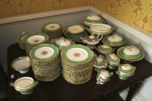 A Victorian Rockingham green gilt and cream large dinner service.