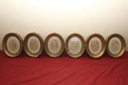 A collection of six oval prints on silk of children in oval gilt frames