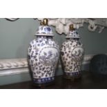 A pair of Chinese blue and white vases. On stands with lion finials to lid, 44cm H.