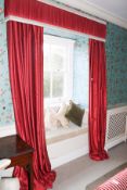 A pair of lined curtains and pelmet.