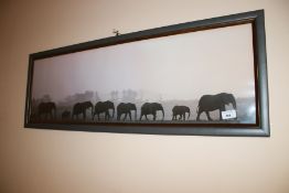 A panoramic photograph of elephants walking in their dorm, 36cm H,