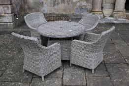 A set of rattan garden furniture comprising table and four chairs