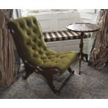 A 20th century mahogany piecrust tripod table and a green velvet button back slipper chair.