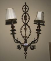 A 20th century Georgian style hare brass two branch wall light.