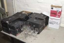 A collection of mostly boxed glassware including wine glasses,