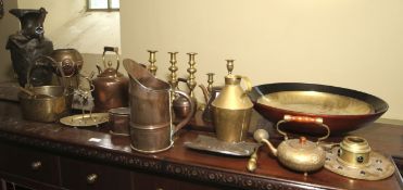 A large collection of metalware including jugs, teapots, kettles, inkwell,