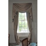 A pair of damask silk lined curtains and matching tasselled pelmet.