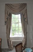 A pair of damask silk lined curtains and matching tasselled pelmet.