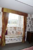 A set of lined curtains with pelmet.