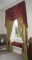 A pair of silk lined curtains with tassled pelmet, with green gold finish,