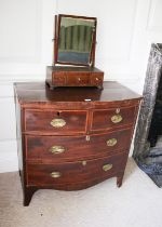 An early to mid 19th century mahogany bow fronted cross banded chest of two short over three long