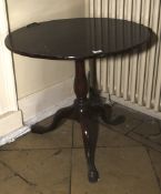 A Georgian mahogany former tilt top table pedestal table. 71cm H, 75cm diameter.