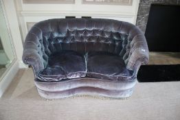 An early 20th century scroll arm button back two seat shaped sofa, 76cm H, 145cm, W,