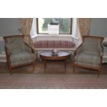A pair of contemporary bergere and upholstered woollen armchairs.