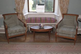 A pair of contemporary bergere and upholstered woollen armchairs.