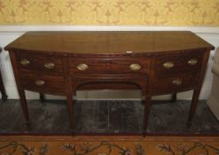 A 19th century mahogany bow front six drawer sideboard.