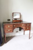 A 19th century shaped mahogany dressing table, 81cm H x 122cm x 60cm,