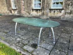 A boardroom, oval glass table,