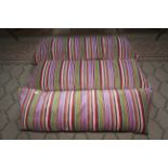 Three contemporary upholstered feather squab window seat cushions.