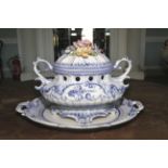 A Continental soft paste tureen and stand. Loop handles and hand painted blue decoration, 32cm H.