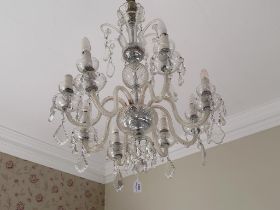 A 20th century cut glass eight branch pendant chandelier with cut glass lustres and swags
