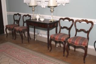 A set of four Victorian rosewood overstuffed balloon back cabriole leg chairs.