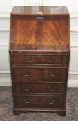 A 20th century mahogany full front bureau. With four graduated drawers, 100cm H, 51cm W, 45cm D.