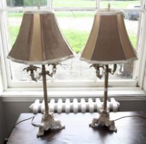 A pair of late 20th century painted tripod two branch table lamps with lustres.