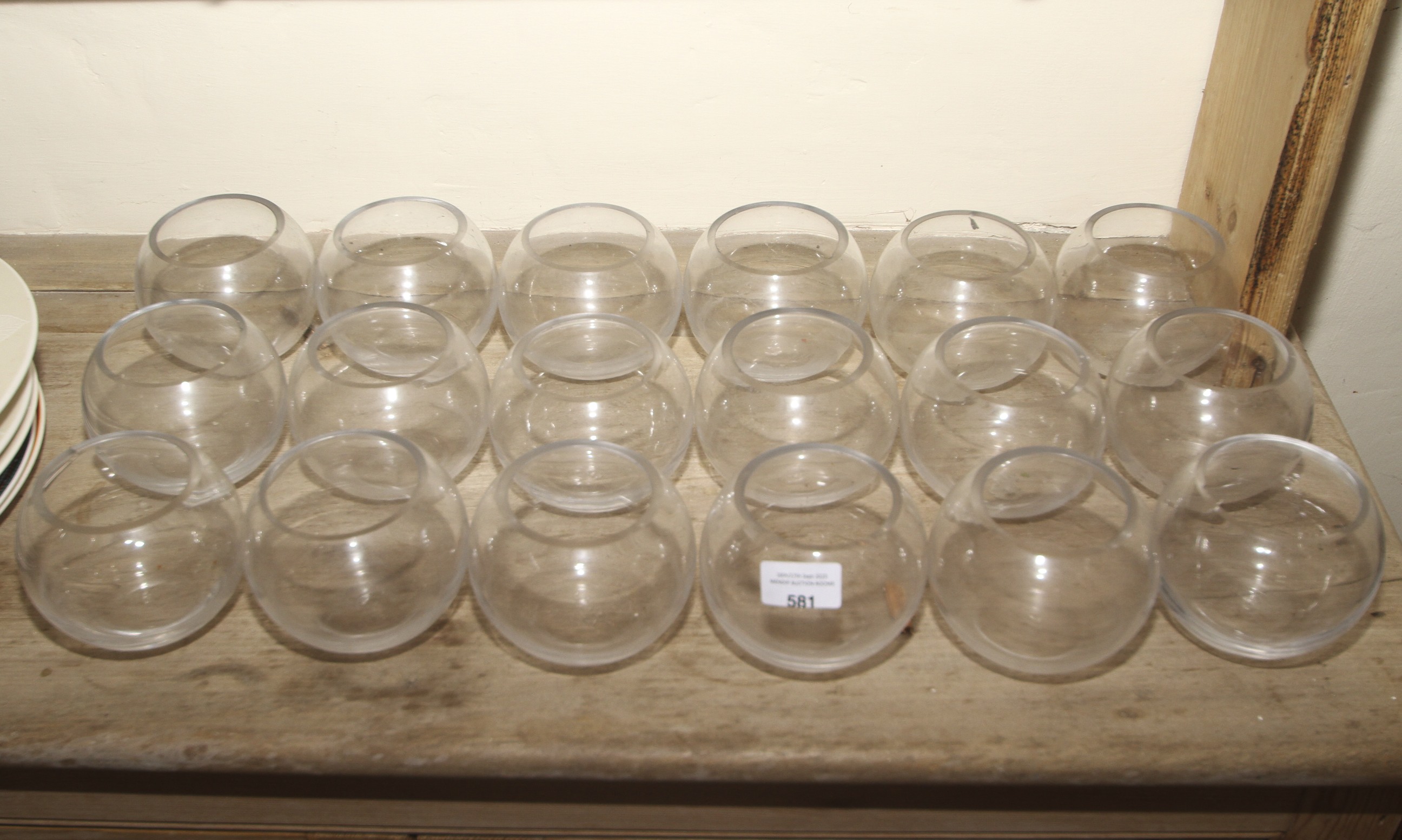 Eighteen glass spherical candle holders for tea light candles