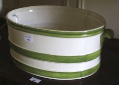 An Italian green and white foot bath. With hand painted banded decoration, 20cm H, 47cm W, 30cm D.