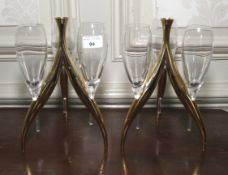A pair of gilt three glass champagne stands. 25cm H.