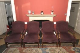 Four Gainsborough style open armchairs.