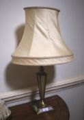 A brass and mirrored glass table lamp with shaped silk shade. 66cm H.