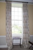A pair of damask silk lined curtains.