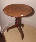 A 19th century oak tripod table.