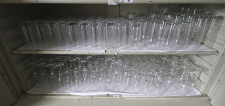 A large assortment of glassware. To include high balls, pint glasses, wine glasses etc.