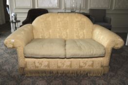 A late Georgian style hump back, 2 and 1/2 seat sofa.