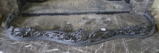 Victorian cast iron serpentine shaped black painted fire fender,