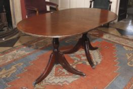 A Regency style cross banded twin pedestal table. 78cm H, 100cm W, 160cm L.