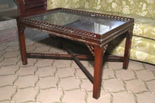 A Chippendale Revival pierced mahogany tray top coffee table.