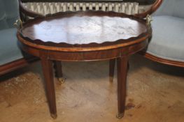 A Sheraton Revival inlaid mahogany oval tray and stand.