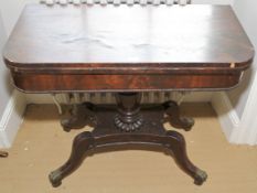 A Regency mahogany fold over tea table.