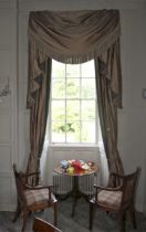 A pair of damask silk lined curtains and matching tasselled pelmet.